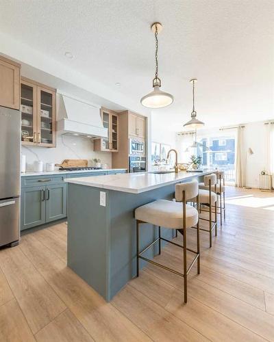 927 Langholm Drive Se, Airdrie, AB - Indoor Photo Showing Kitchen With Stainless Steel Kitchen With Upgraded Kitchen