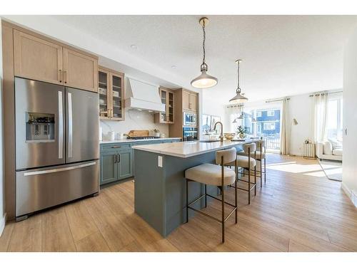 927 Langholm Drive Se, Airdrie, AB - Indoor Photo Showing Kitchen With Stainless Steel Kitchen With Upgraded Kitchen