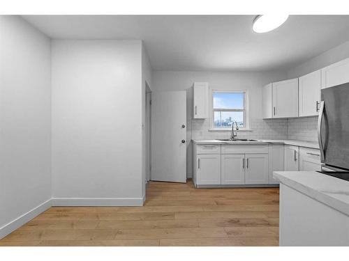 5219 50 Avenue, Camrose, AB - Indoor Photo Showing Kitchen With Double Sink