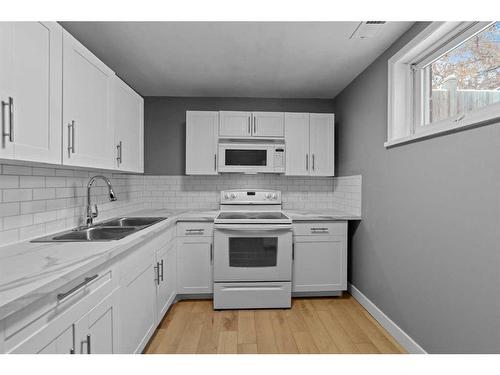 5219 50 Avenue, Camrose, AB - Indoor Photo Showing Kitchen With Double Sink