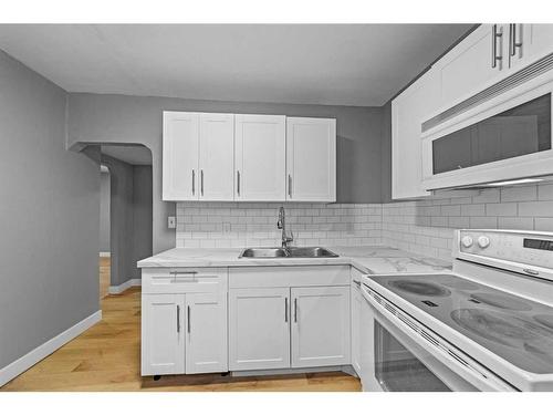 5219 50 Avenue, Camrose, AB - Indoor Photo Showing Kitchen With Double Sink