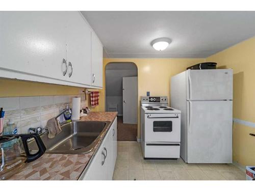 5219 50 Avenue, Camrose, AB - Indoor Photo Showing Kitchen With Double Sink