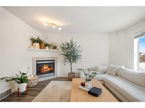 67 Ponderosa Avenue, Blackfalds, AB - Indoor Photo Showing Living Room With Fireplace