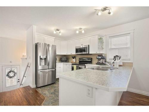 67 Ponderosa Avenue, Blackfalds, AB - Indoor Photo Showing Kitchen With Stainless Steel Kitchen With Double Sink