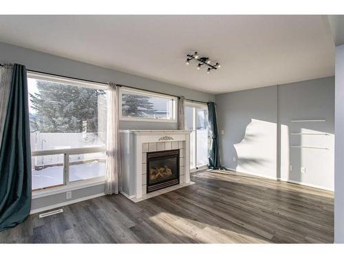 22-6300 Orr Drive, Red Deer, AB - Indoor Photo Showing Living Room With Fireplace