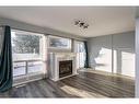 22-6300 Orr Drive, Red Deer, AB  - Indoor Photo Showing Living Room With Fireplace 