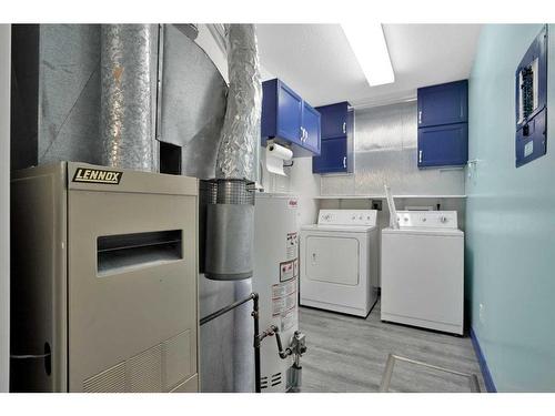 2-802 1 Street Nw, Sundre, AB - Indoor Photo Showing Laundry Room