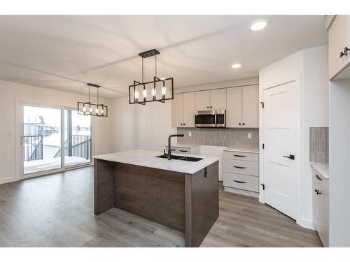 14 Artemis Place, Blackfalds, AB - Indoor Photo Showing Kitchen With Double Sink