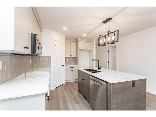 14 Artemis Place, Blackfalds, AB - Indoor Photo Showing Kitchen With Double Sink