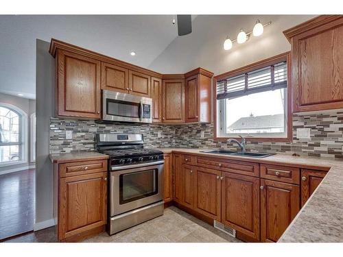 12 Hagerman Close, Sylvan Lake, AB - Indoor Photo Showing Kitchen With Double Sink