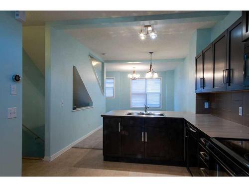 177 New Brighton Point Se, Calgary, AB - Indoor Photo Showing Kitchen With Double Sink