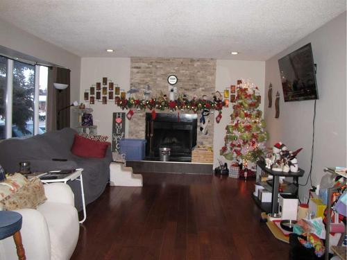 5223 37 Street, Innisfail, AB - Indoor Photo Showing Living Room With Fireplace