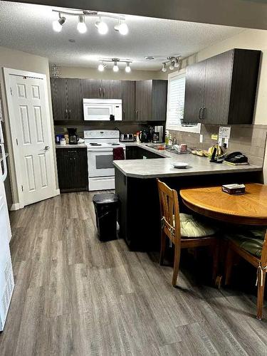 3707 51 Avenue, Red Deer, AB - Indoor Photo Showing Kitchen With Double Sink