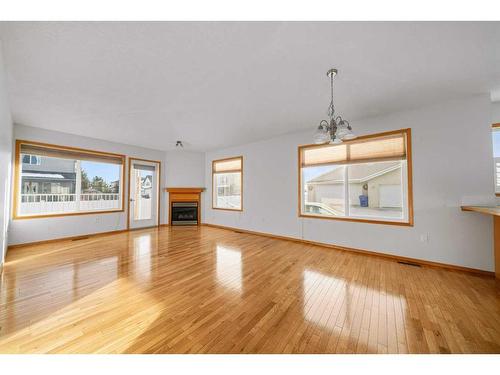 25-6009 62 Avenue, Olds, AB - Indoor Photo Showing Living Room With Fireplace