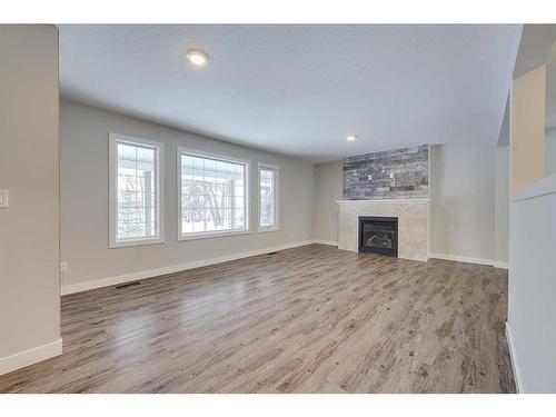 43-26553 Highway 11, Rural Red Deer County, AB - Indoor Photo Showing Living Room With Fireplace