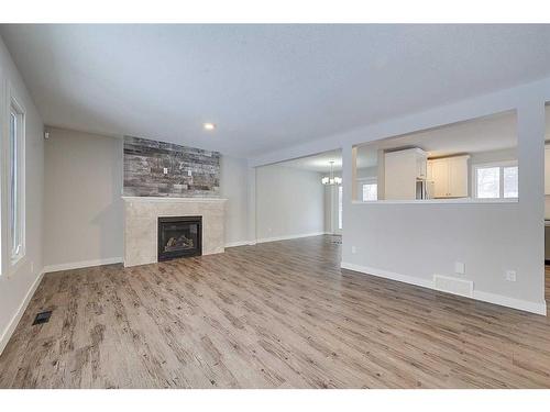 43-26553 Highway 11, Rural Red Deer County, AB - Indoor Photo Showing Living Room With Fireplace