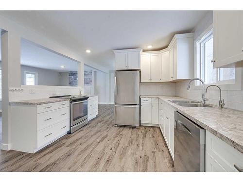 43-26553 Highway 11, Rural Red Deer County, AB - Indoor Photo Showing Kitchen With Double Sink