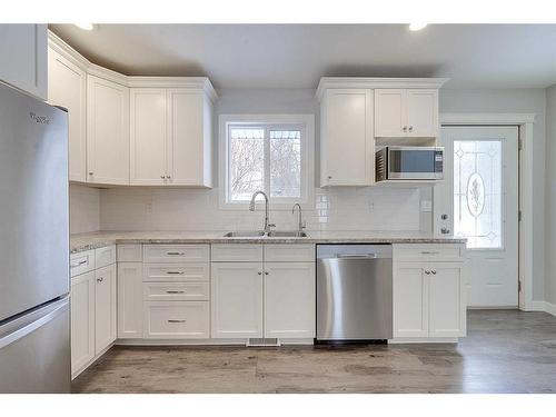 43-26553 Highway 11, Rural Red Deer County, AB - Indoor Photo Showing Kitchen With Double Sink