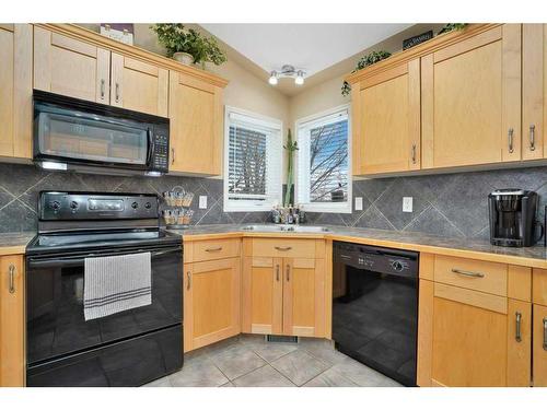 37 Downing Close, Red Deer, AB - Indoor Photo Showing Kitchen With Double Sink