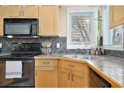 37 Downing Close, Red Deer, AB - Indoor Photo Showing Kitchen With Double Sink