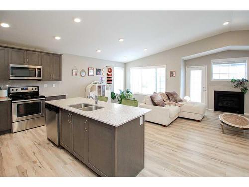 23 Golden Crescent, Red Deer, AB - Indoor Photo Showing Kitchen With Fireplace With Stainless Steel Kitchen With Double Sink