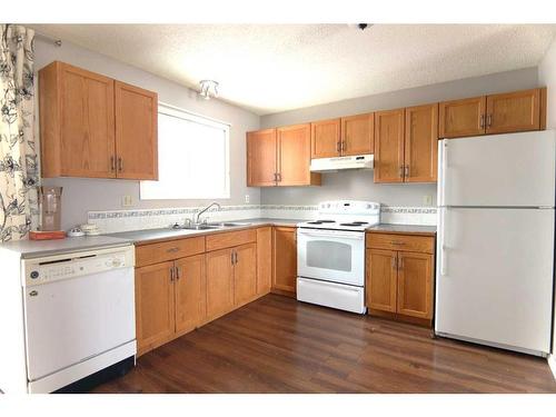 57 Westview Drive, Sylvan Lake, AB - Indoor Photo Showing Kitchen With Double Sink