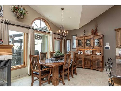 38423 Range Road 282, Rural Red Deer County, AB - Indoor Photo Showing Dining Room With Fireplace