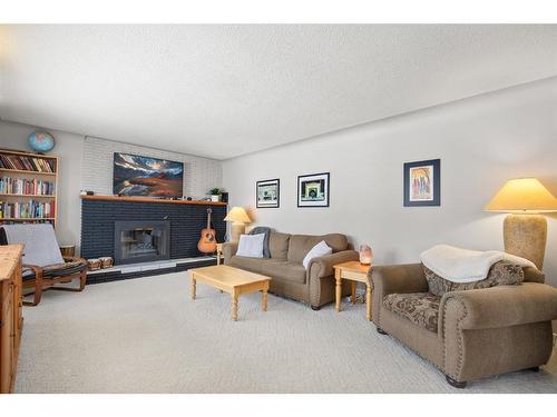 4411 35 Street, Red Deer, AB - Indoor Photo Showing Living Room With Fireplace