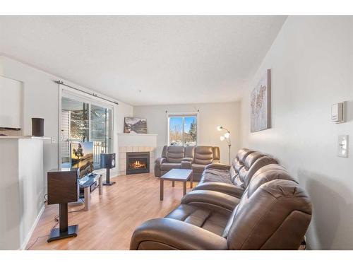 102-60 Lawford Avenue, Red Deer, AB - Indoor Photo Showing Living Room With Fireplace