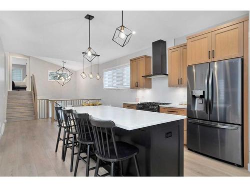 10 Songbird Green, Sylvan Lake, AB - Indoor Photo Showing Kitchen With Stainless Steel Kitchen