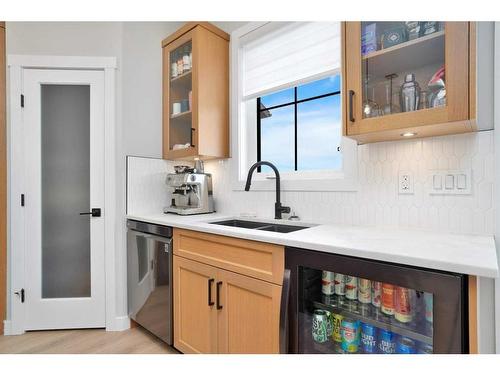 10 Songbird Green, Sylvan Lake, AB - Indoor Photo Showing Kitchen With Double Sink