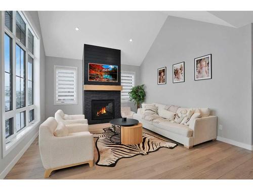 10 Songbird Green, Sylvan Lake, AB - Indoor Photo Showing Living Room With Fireplace