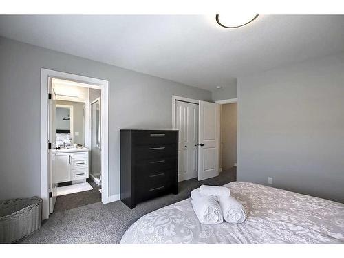 13 Iron Gate Boulevard, Sylvan Lake, AB - Indoor Photo Showing Bedroom