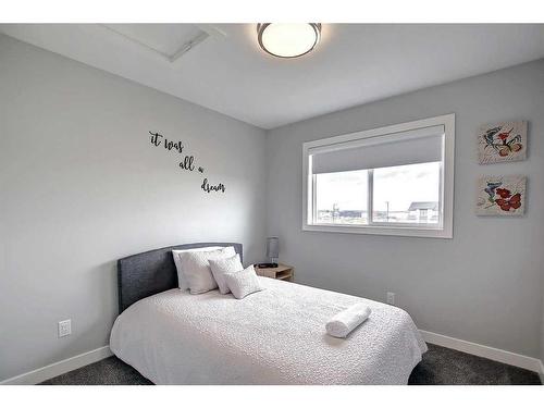 13 Iron Gate Boulevard, Sylvan Lake, AB - Indoor Photo Showing Bedroom