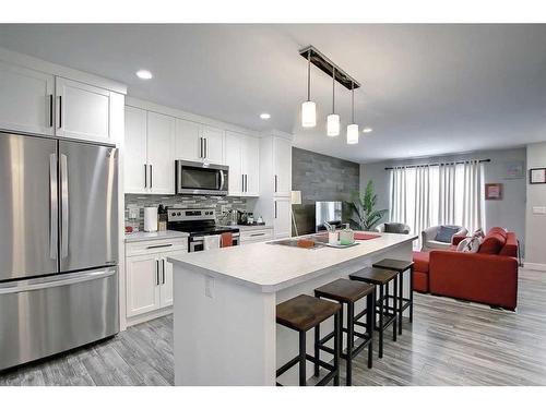 13 Iron Gate Boulevard, Sylvan Lake, AB - Indoor Photo Showing Kitchen With Upgraded Kitchen