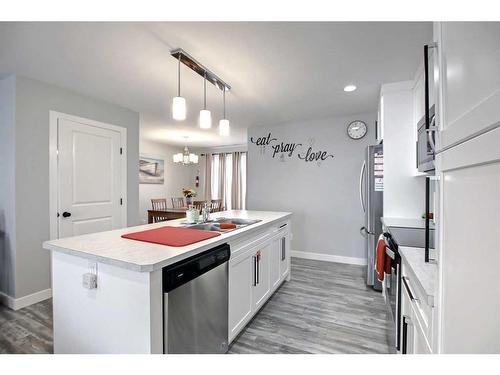 13 Iron Gate Boulevard, Sylvan Lake, AB - Indoor Photo Showing Kitchen With Double Sink