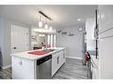 13 Iron Gate Boulevard, Sylvan Lake, AB  - Indoor Photo Showing Kitchen With Double Sink 