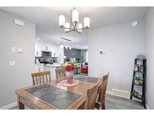 13 Iron Gate Boulevard, Sylvan Lake, AB - Indoor Photo Showing Dining Room