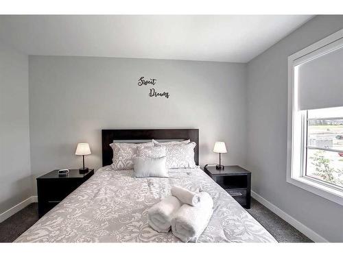 13 Iron Gate Boulevard, Sylvan Lake, AB - Indoor Photo Showing Bedroom