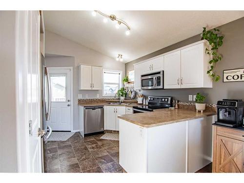 150 Cooper Close, Red Deer, AB - Indoor Photo Showing Kitchen With Stainless Steel Kitchen