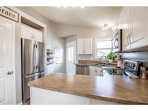 150 Cooper Close, Red Deer, AB - Indoor Photo Showing Kitchen With Stainless Steel Kitchen With Double Sink