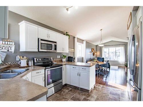 150 Cooper Close, Red Deer, AB - Indoor Photo Showing Kitchen With Stainless Steel Kitchen With Double Sink