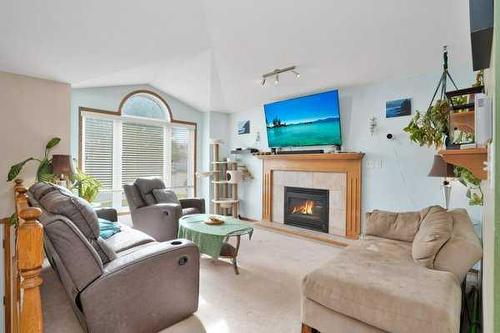 72 Perry Drive, Sylvan Lake, AB - Indoor Photo Showing Living Room With Fireplace