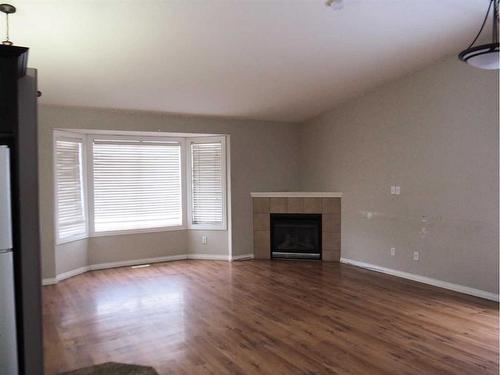 6197 Orr Drive, Red Deer, AB - Indoor Photo Showing Living Room With Fireplace