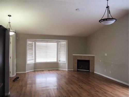 6197 Orr Drive, Red Deer, AB - Indoor Photo Showing Living Room With Fireplace