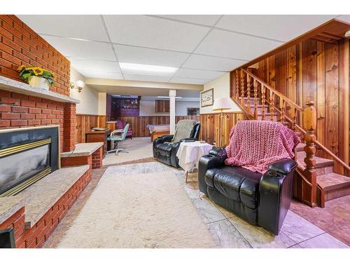 49 Wiltshire Boulevard, Red Deer, AB - Indoor With Fireplace