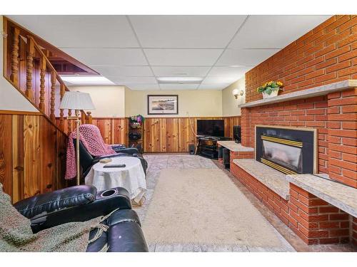 49 Wiltshire Boulevard, Red Deer, AB - Indoor With Fireplace