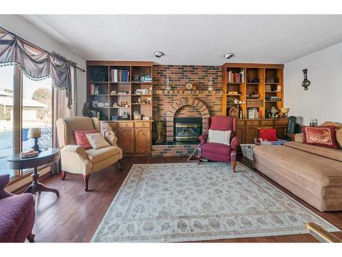 49 Wiltshire Boulevard, Red Deer, AB - Indoor Photo Showing Living Room With Fireplace