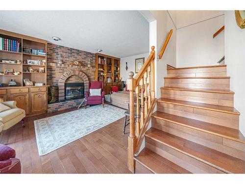 49 Wiltshire Boulevard, Red Deer, AB - Indoor With Fireplace