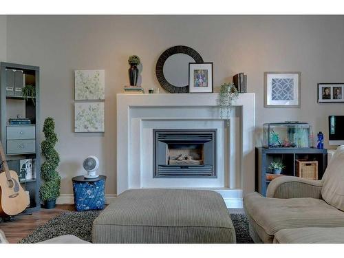 111 Anquetel Street, Red Deer, AB - Indoor Photo Showing Living Room With Fireplace